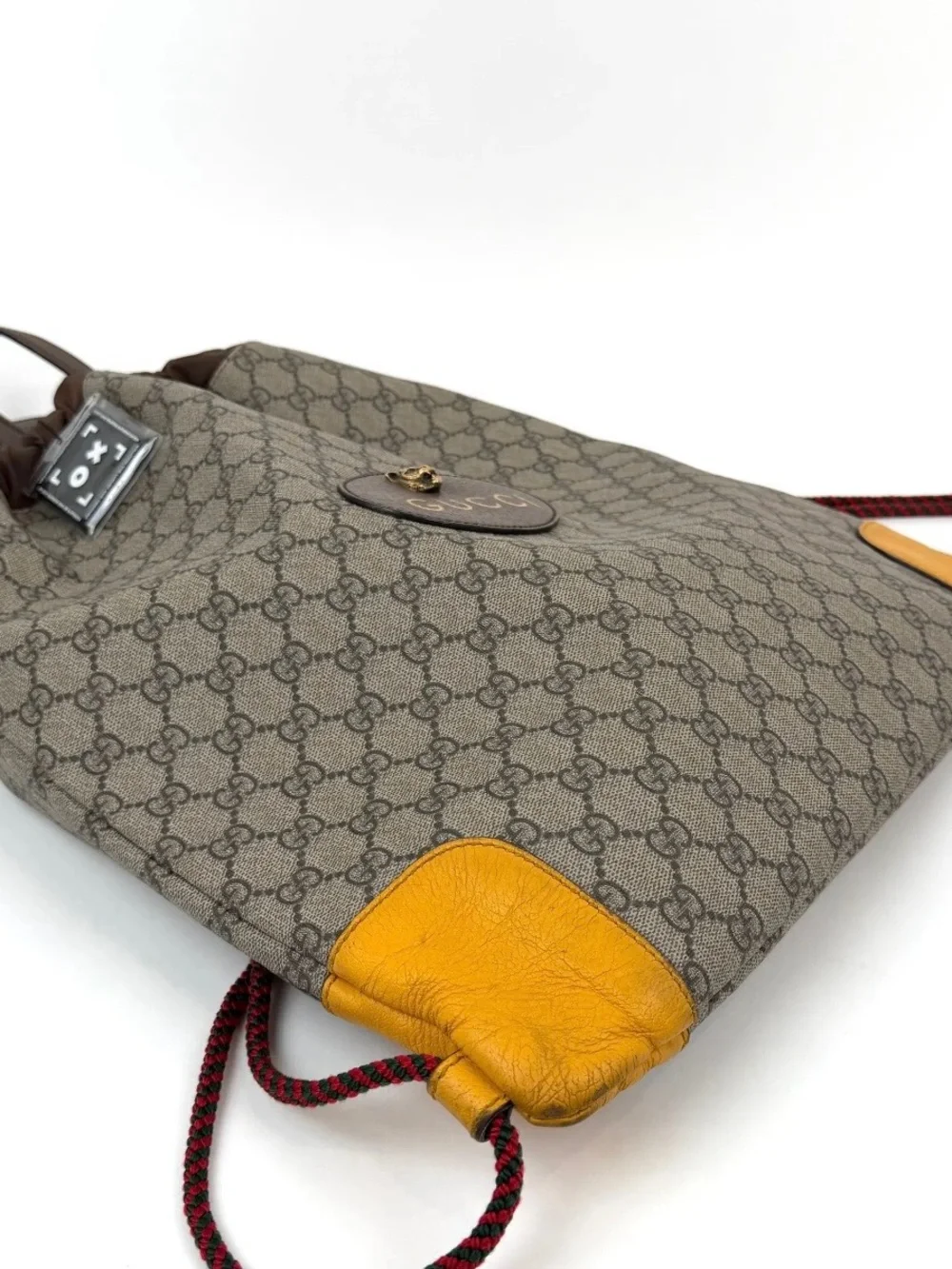 Pre Loved Gucci Beige GG Canvas Drawstring Backpack with Yellow Leather Accents